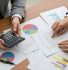 CPA reviewing financial charts to help Elmhurst business owners reduce tax liability